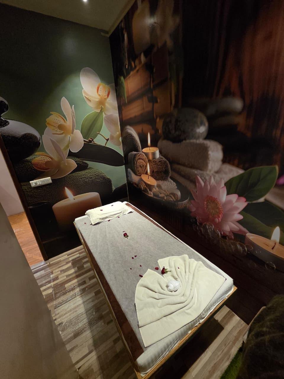 Treatment bed with towel decor and candles